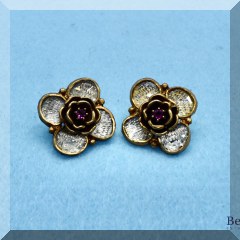 J51. Goldtone red center stone flower earrings. - $12